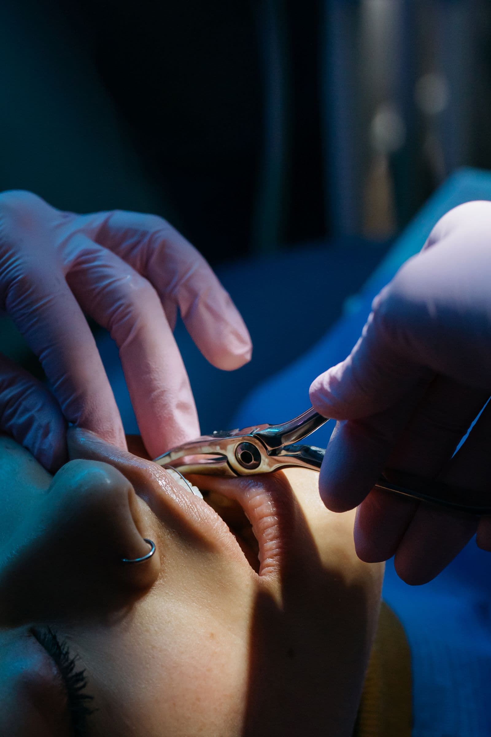 Dentist examining a patient's teeth and gums
