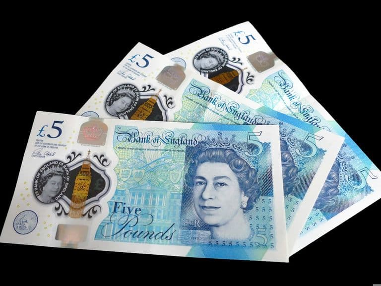British five pound notes, representing dental finance and payment options