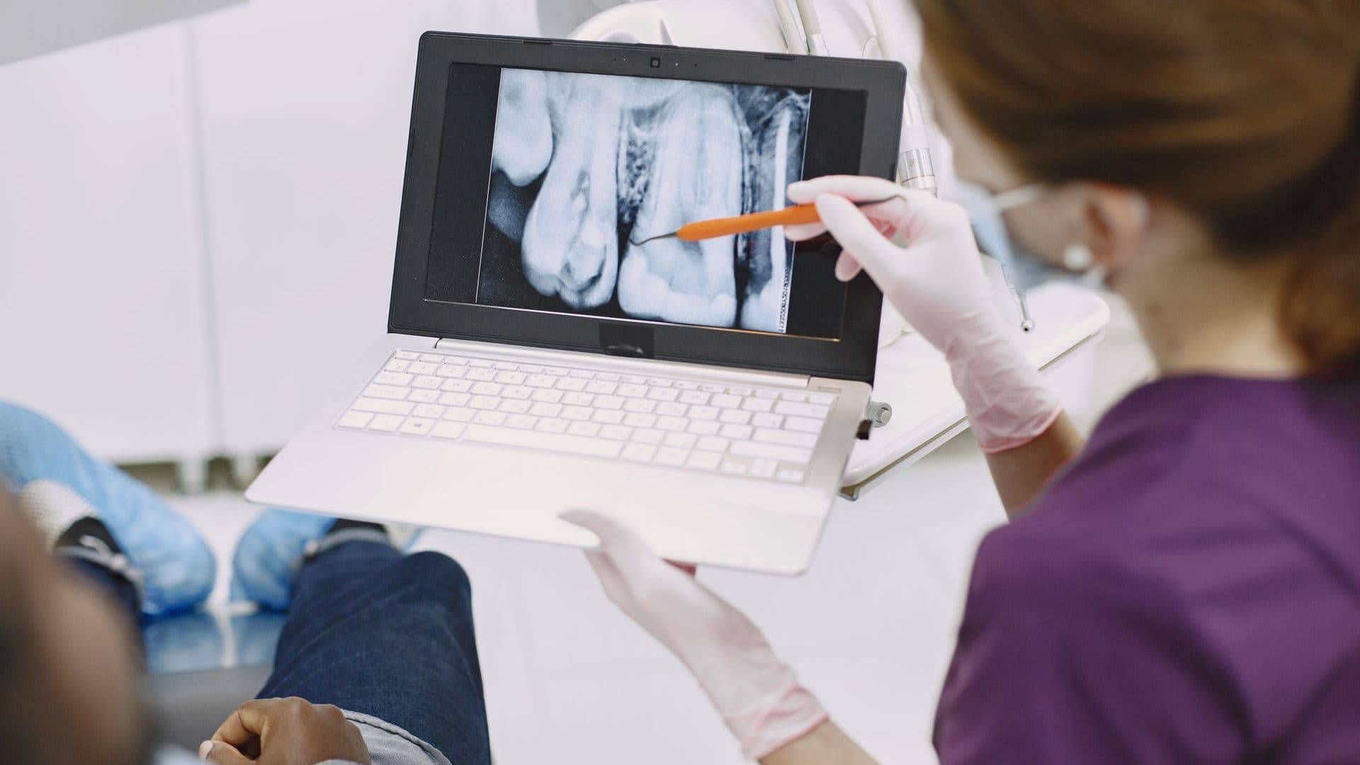 Dentist explaining x-ray results to a patient