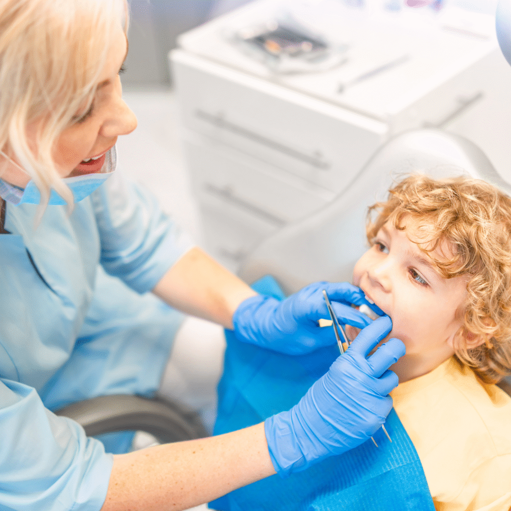 Dentist looking at child's teeth